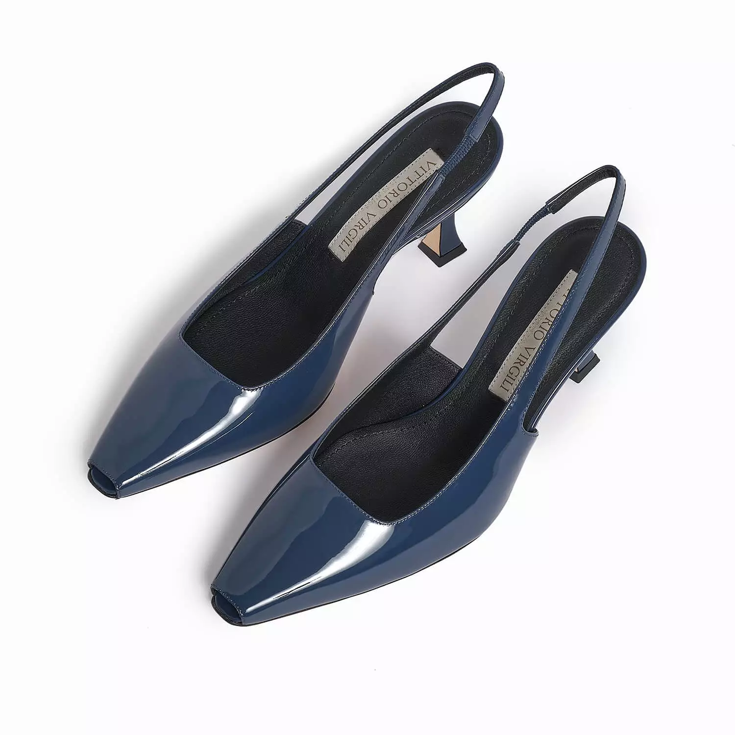 Blue women's patent leather slingback pump.