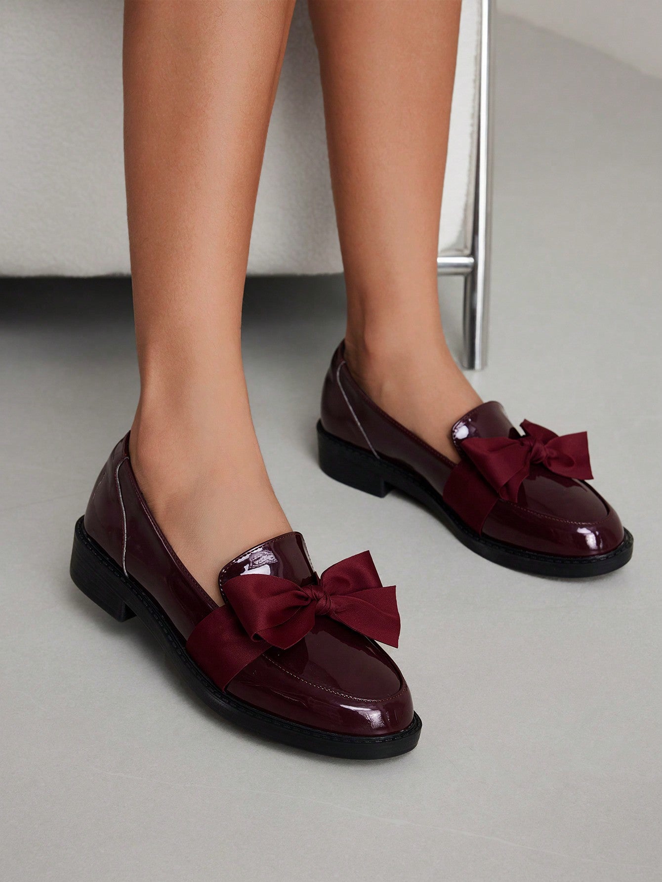 Fashionable burgundy bow flat loafers for women's spring and summer footwear.