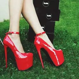 Red patent high heel shoes with ankle strap.